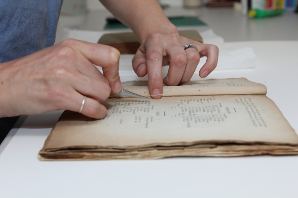 A book is rebound as part of MCC's conservation work